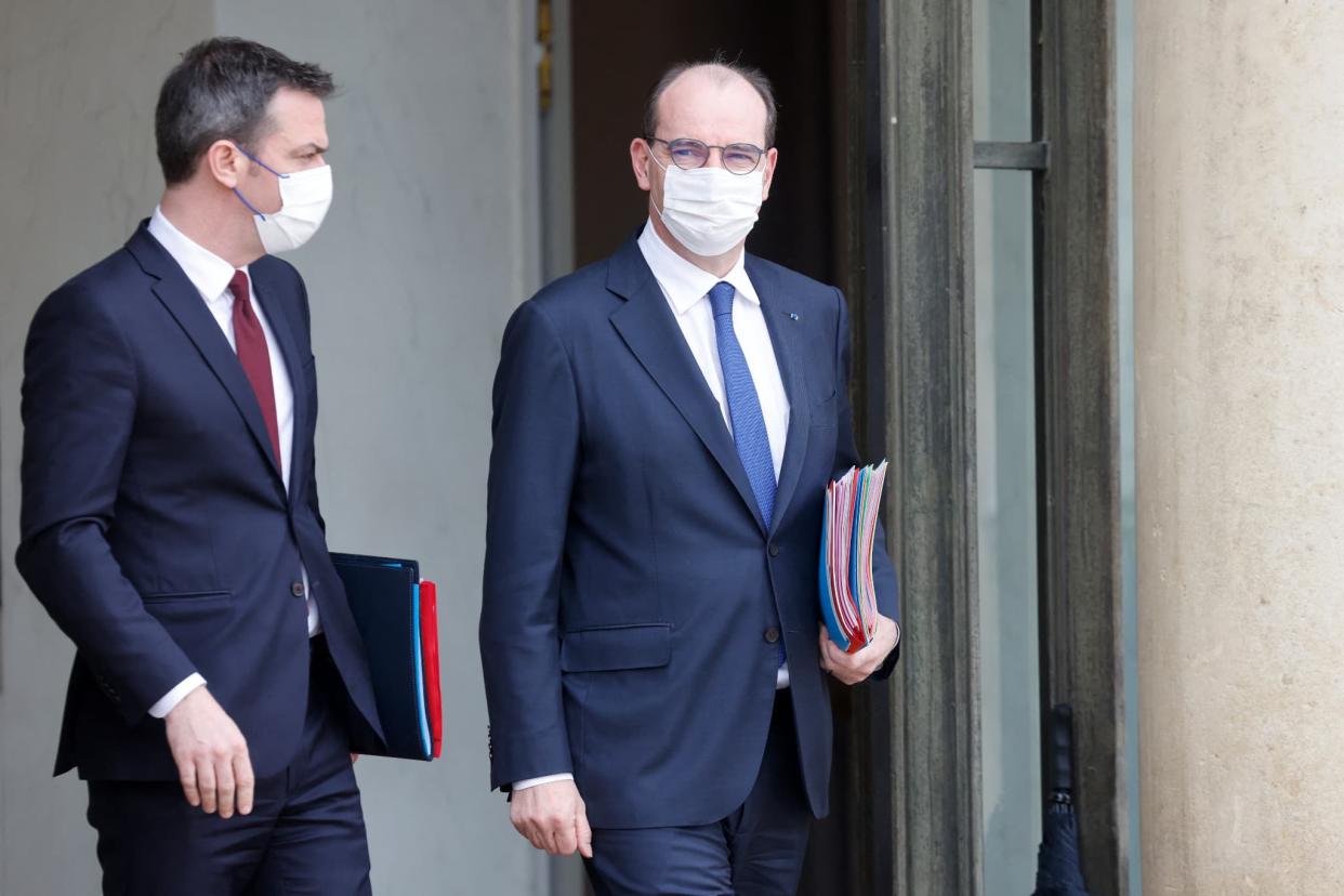 Olivier Véran et Jean Castex, au palais de l'Élysée le 10 mars 2021. - Ludovic MARIN / AFP