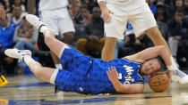 Orlando Magic guard Joe Ingles grabs a loose ball before passing to a teammate during the second half of an NBA basketball game against the Los Angeles Clippers, Friday, March 29, 2024, in Orlando, Fla. (AP Photo/John Raoux)