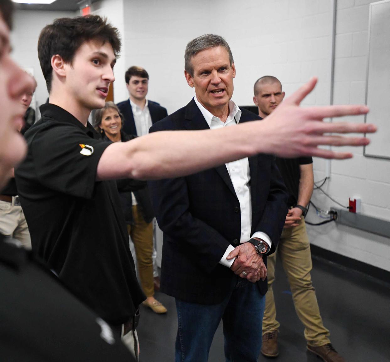 Jackson State AMT student Rylan Coffman explains to Gov. Bill Lee the workings of a hydrolic pump during Gov. Bill Lee's tour of Jackson State TCAT facilities in Jackson, Tenn., on Tuesday, Feb.6, 2024.