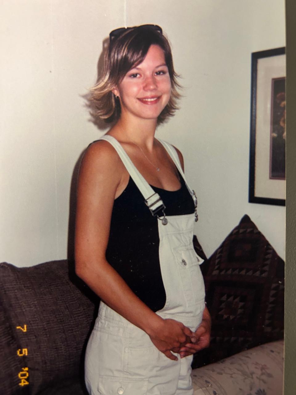 Laura Jones is pictured when she was pregnant with her first child around 20 years old.