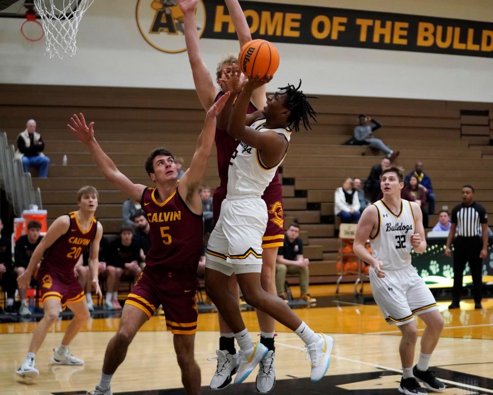 Adrian College's Braylon Dickerson goes up for a layup during Wednesday's game at home against Calvin.