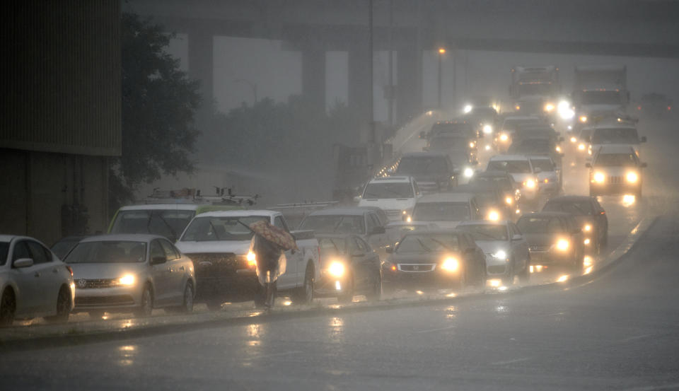 Traffic backs up as rain come down at Airline Drive and S. Carrollton Ave. in New Orleans, as severe thunderstorms cause street flooding Wednesday, July 10, 2019. (Max Becherer/The Advocate via AP)