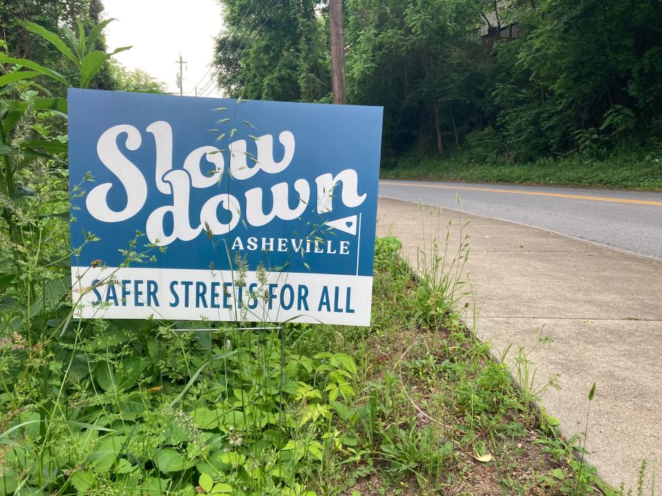 A "Slow Down Asheville" sign on Sand Hill Road in West Asheville on May 23, 2023.