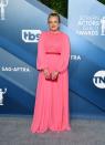 Moss traded her "Handmaids Tale" rob for a 1970s inspired pink and red look by Monique Lhuillier.