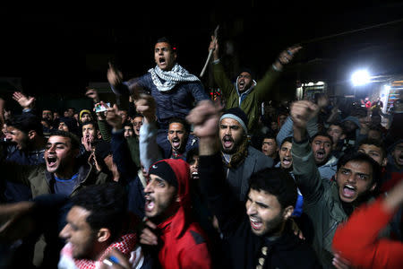 Palestinians react during a protest against U.S. President Donald Trump's decision to recognise Jerusalem as Israel's capital, in Khan Younis in the southern Gaza Strip December 6, 2017. REUTERS/Ibraheem Abu Mustafa