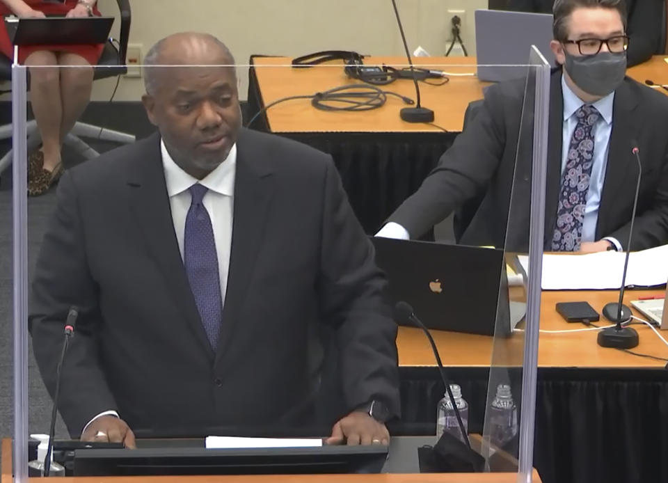 In this image from video, prosecutor Jerry Blackwell, left, speaks while defense attorney Eric Nelson, right, listens, as Hennepin County Judge Peter Cahill presides during opening statements, Monday, March 29, 2021, in the trial of former Minneapolis police officer Derek Chauvin, in the May 25, 2020, death of George Floyd at the Hennepin County Courthouse in Minneapolis, Minn. (Court TV via AP, Pool)