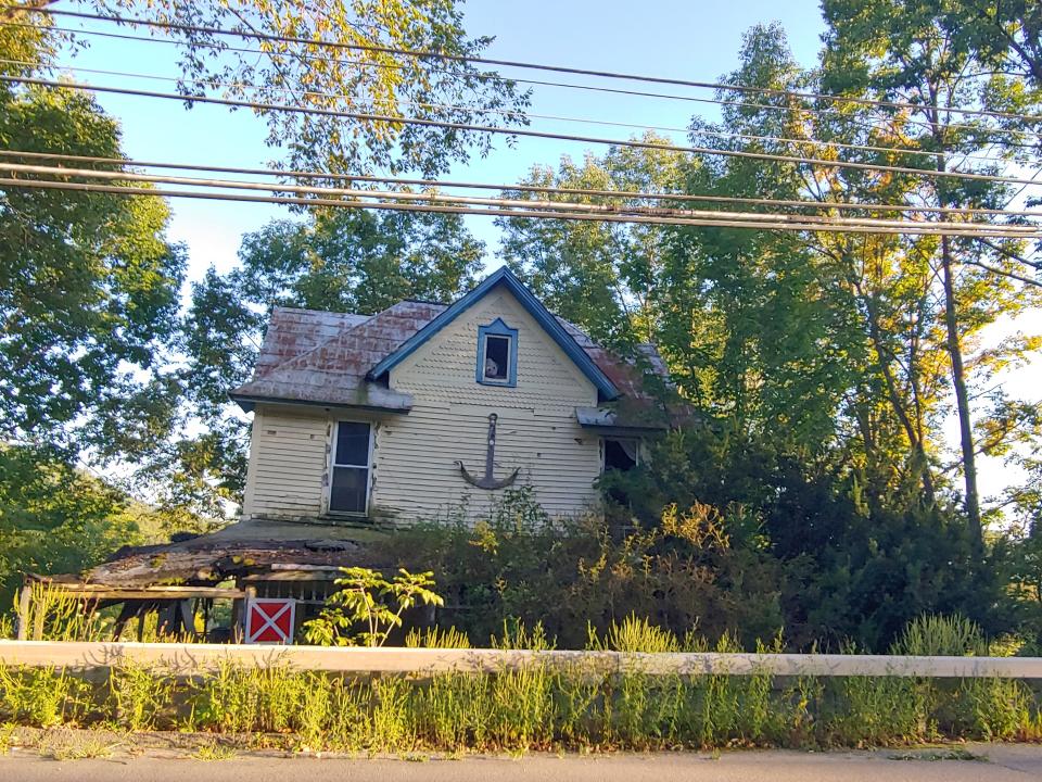 In this 2019 photo, a red and white X sign marks this East State Street property in the Village of Wellsville for demolition. New village laws may make it easier for the village to address properties that do not meet codes.