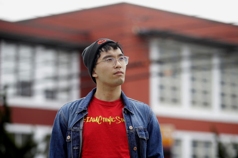 In this March 31, 2020, photo, Kyle Navarro poses in San Francisco. The school nurse was recently unlocking his bicycle when an older white man called him a racial slur and spat at him. Asian Americans are using social media to organize and fight back against racially motivated attacks during the coronavirus pandemic, which the FBI predicts will increase as infections grow. (AP Photo/Jeff Chiu)