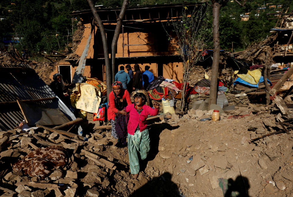 A woman cries as she stands on the rubble of her collapsed house where the members of her family died during an earthquake in Jajarkot, Nepal, Nov. 5, 2023. / Credit: NAVESH CHITRAKAR/REUTERS