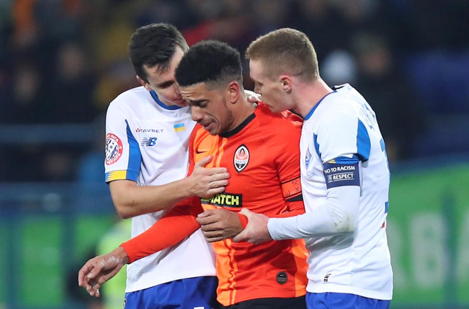 Soccer Football - Ukrainian Premier League - Shakhtar Donetsk v Dynamo Kiev - Metalist Stadium, Kharkiv, Ukraine - November 10, 2019. Dynamo Kiev's Viktor Tsygankov and Mykola Shaparenko console Shakhtar Donetsk's Taison, who reacts to presumed racist insults. Picture taken November 10, 2019. REUTERS/Oleksandr Osipov