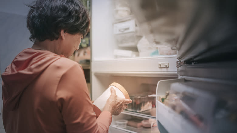 Person with ice cream container