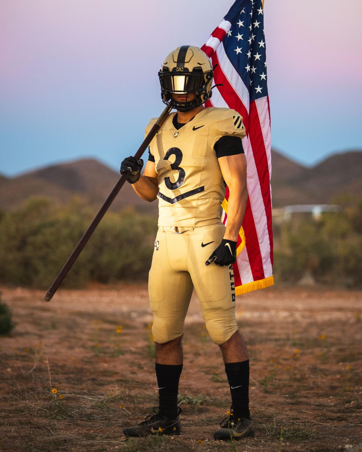The Army football uniform to be used in the Navy game is a new NIKE design. It is tan in color.