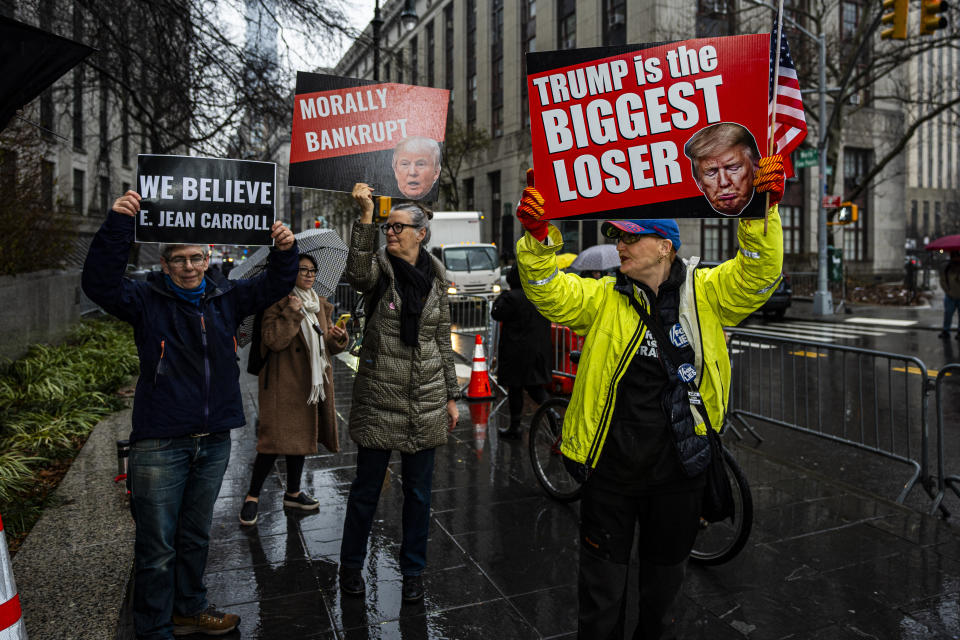 Protestors demonstrate outside Federal Court, Thursday, Jan. 25, 2024, in New York. Former President Donald Trump could return to a New York courtroom Thursday to defend himself against a lawsuit seeking more than $10 million for things he said about advice columnist E. Jean Carroll after she accused him of sexual assault. (AP Photo/Peter K. Afriyie)