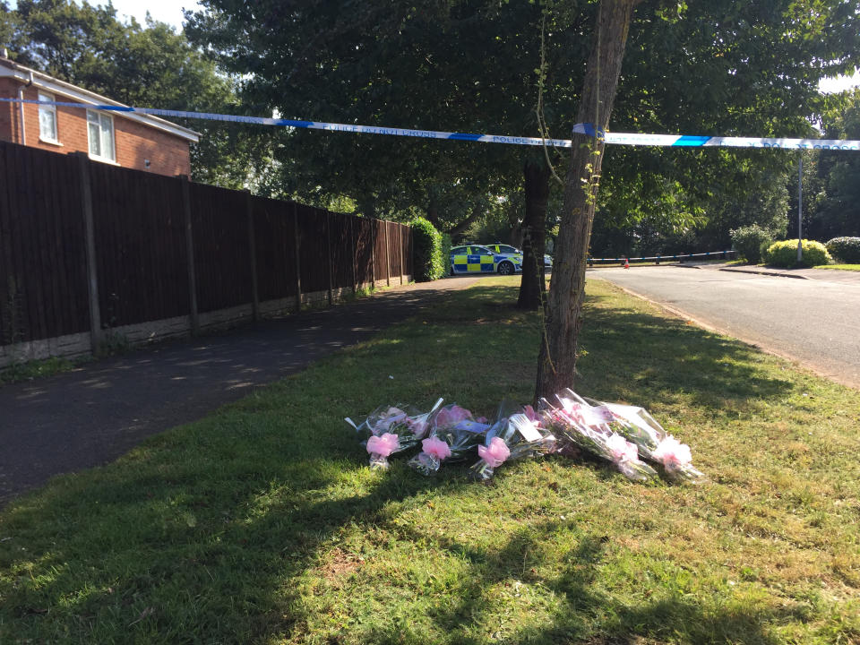 Floral tributes left at the scene in Wigginton Park, Tamworth, Staffordshire, where a 19-year-old woman died on Thursday evening.