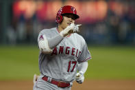 Los Angeles Angels designated hitter Shohei Ohtani gestures while rounding the bases during the fifth inning of a baseball game against the Kansas City Royals at Kauffman Stadium in Kansas City, Mo., Tuesday, April 13, 2021. Ohtani hit a solo home run on the play. (AP Photo/Orlin Wagner)