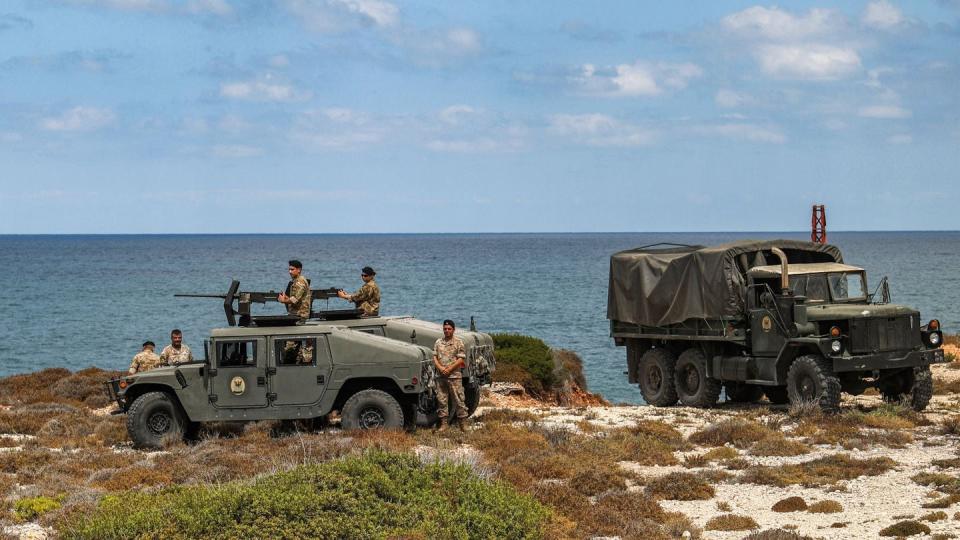 Lebanese soldiers, equipped with turrets on military vehicles, patrol the country's southern border on Aug. 8, 2023. (Anwar Amro/AFP via Getty Images)