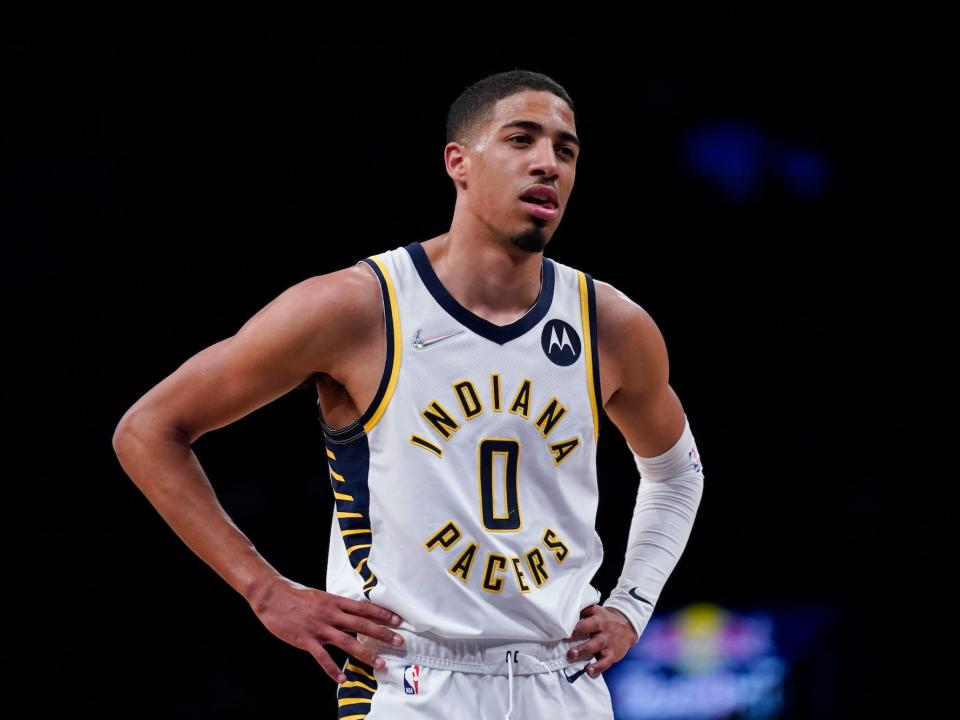 Tyrese Haliburton stands with his hands on his hips during a Pacers game in 2022.