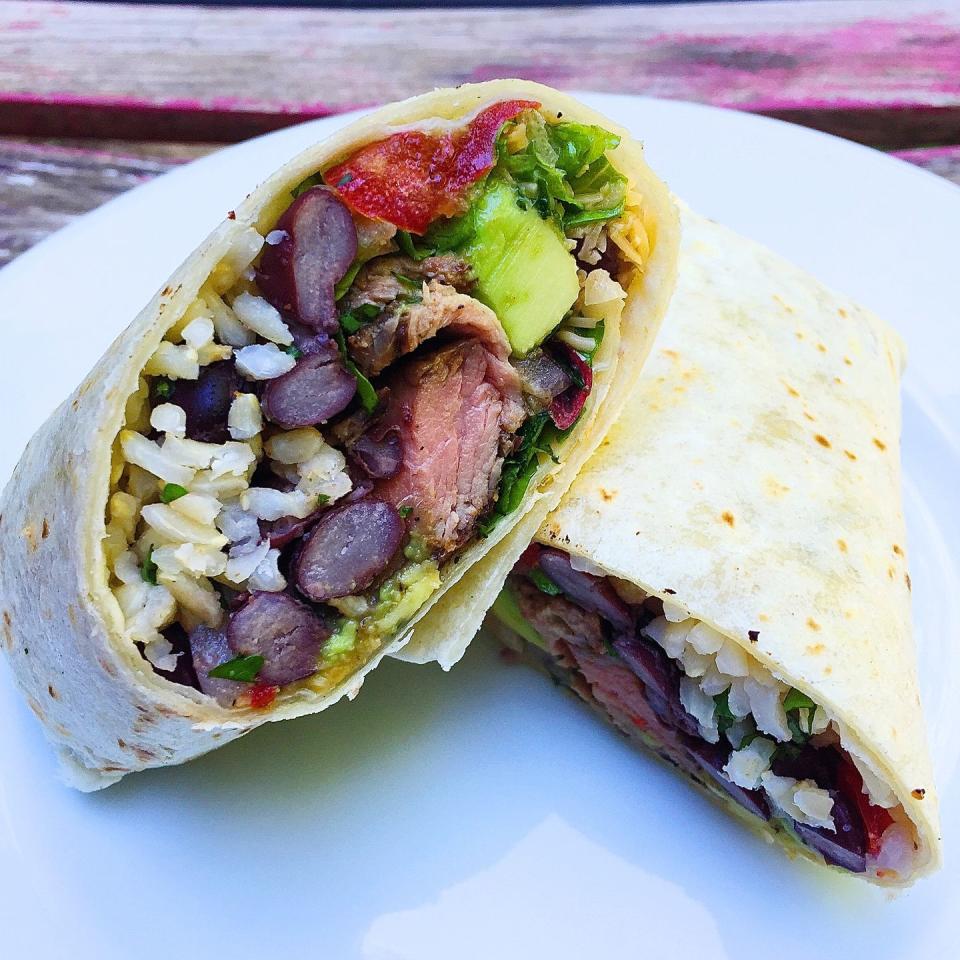 <p>Got leftovers? Not anymore, now that you can bring new life to them by throwing them all inside of this steak burrito! </p><p>Get the <strong><a href="https://www.delish.com/cooking/recipe-ideas/recipes/a43967/grilled-steak-burritos-avocado-pico-de-gallo-recipe/" rel="nofollow noopener" target="_blank" data-ylk="slk:Grilled Steak Burritos with Avocado Pico de Gallo recipe;elm:context_link;itc:0;sec:content-canvas" class="link ">Grilled Steak Burritos with Avocado Pico de Gallo recipe</a>.</strong> </p>