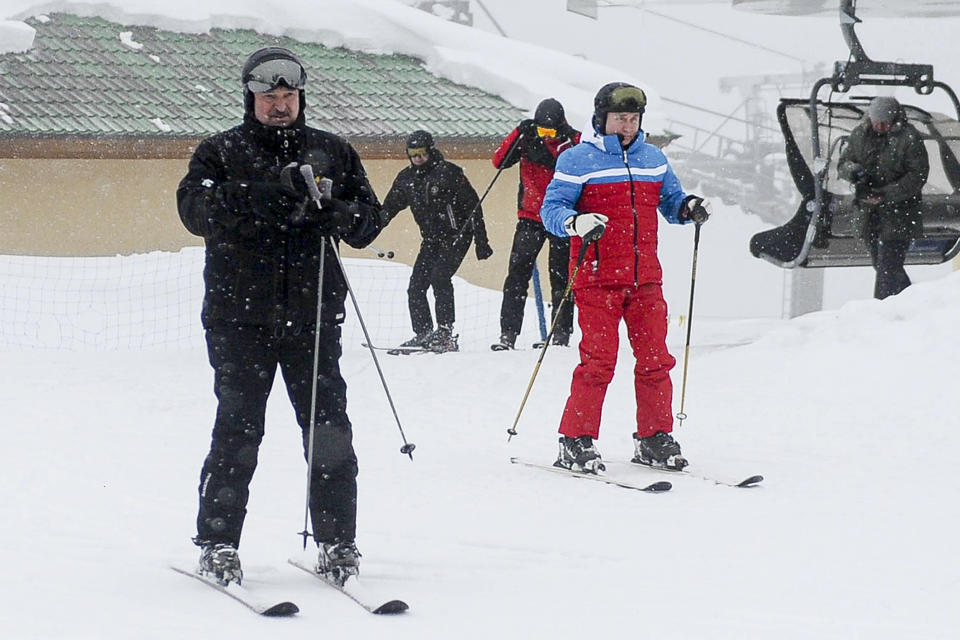 Russian President Vladimir Putin, right, and Belarusian President Alexander Lukashenko arrive at the mountain resort of Krasnaya Polyana near the Black Sea resort of Sochi, Russia, Monday, Feb. 22, 2021. (Alexei Druzhinin, Sputnik, Kremlin Pool Photo via AP)