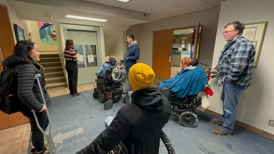 Accessibility advocates are confronted with a broken elevator at Whitehorse city hall as they make their way to council meeting, Dec. 12, 2023. 