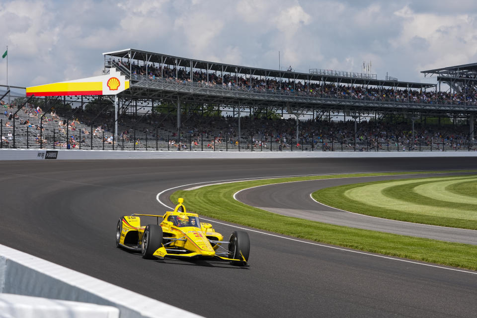 Scott McLaughlin, of New Zealand, drives through the first turn during qualifications for the Indianapolis 500 auto race at Indianapolis Motor Speedway in Indianapolis, Saturday, May 18, 2024. (AP Photo/Michael Conroy)