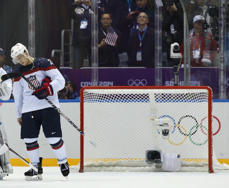 USA defenseman Kevin Shattenkirk reacts after losing to Canada 1-0 in a men's semifinal ice hockey game at the 2014 Winter Olympics, Friday, Feb. 21, 2014, in Sochi, Russia. (AP Photo/Julio Cortez)