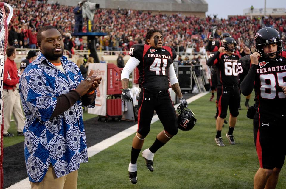 Patrice Majondo-Mwamba watches Texas Tech score a touchdown against Kansas State from the sidelines of Jones AT&T Stadium, Saturday Oct. 10, 2009. Majondo-Mwamba is the president of the Mwamba Family Foundation, a charity committed to helping children in his native country of The Democratic Republic of Congo.
