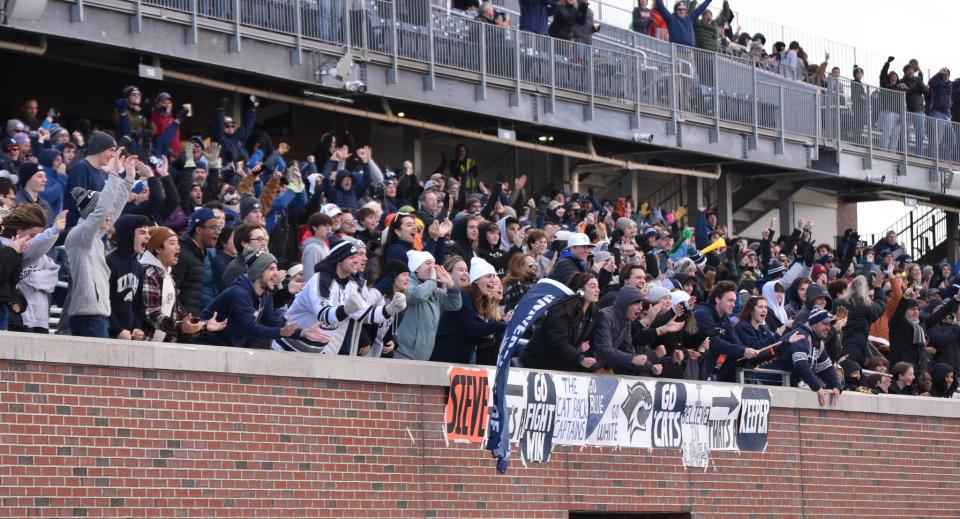 Fans cheer on the UNH men's soccer team in Sunday's NCAA second-round tournament game against Syracuse. UNH coach Marc Hubbard expects a record-setting crowd for this Sunday's third-round game at Wildcat Stadium against Clemson.