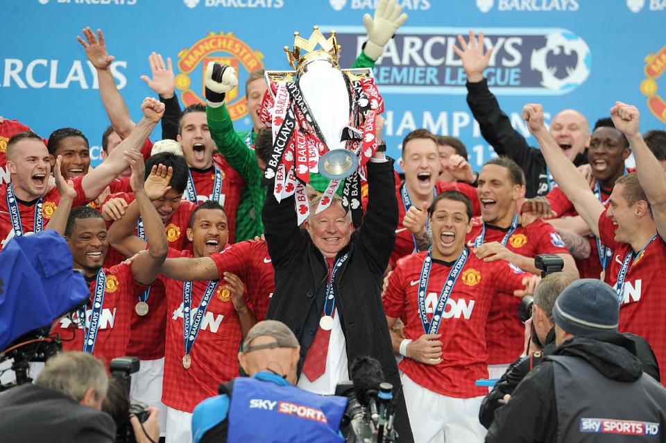 Manchester United manager Sir Alex Ferguson lifts the Barclays Premier League trophy