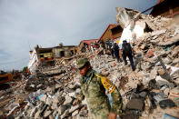 <p>Soldiers work to remove the debris of a house destroyed in an earthquake that struck off the southern coast of Mexico late on Thursday, in Juchitan, Mexico, Sept. 8, 2017. (Photo: Edgard Garrido/Reuters) </p>