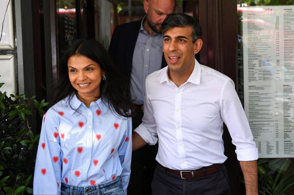 Rishi Sunak campaigning with his wife Akshata Murty (Chris J Ratcliffe/PA Wire)