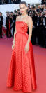 <p>The model arrived at the red carpet premiere of <em>Okja </em>is a quilted red Dior Haute Couture gown and a serpentine Bulgari diamond necklace and bracelet.</p>