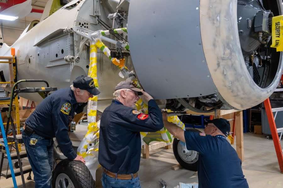 Volunteers work to restore the Wildcat. (Air Zoo)