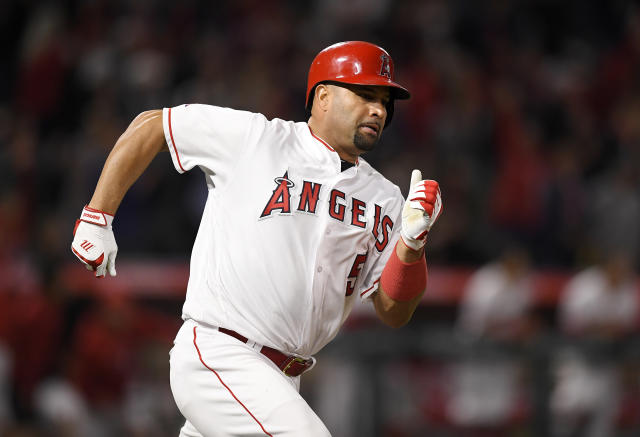 Major League Baseball player Albert Pujols and his daughter arrive