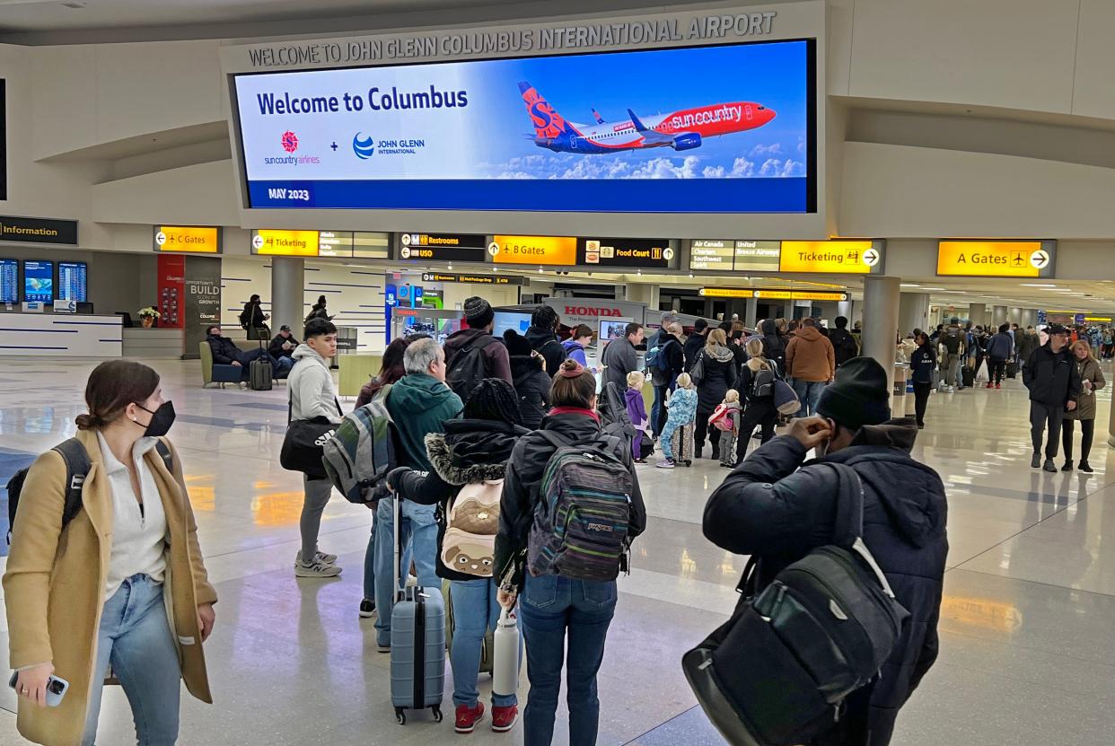 The line for the B concourse TSA security checkpoint at John Glenn International Airport stretches back to the ticketing area Wednesday morning Dec 28, 2022.