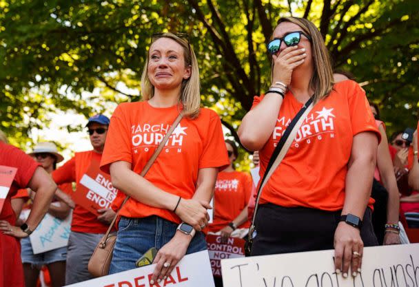 PHOTO: Abby Brosio, left, and Allie Burby, of Chicago, fight back tears during a rally at the U.S. Capitol, July 13, 2022 to call for stronger gun control measures including universal background checks and an assault weapons ban. (Josh Morgan/USA Today)