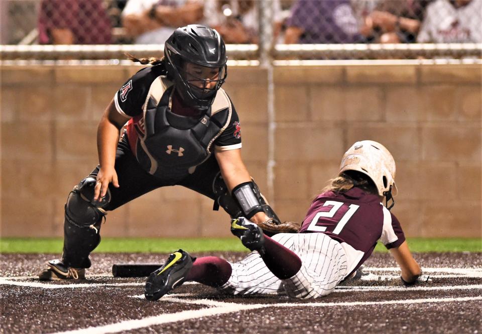 Eula's Hallie Cauthen, right, scores on Laney Fostel's sacrifice bunt as Aspermont catcher Mikayla Daniel stretches to make the tag in the second inning.
