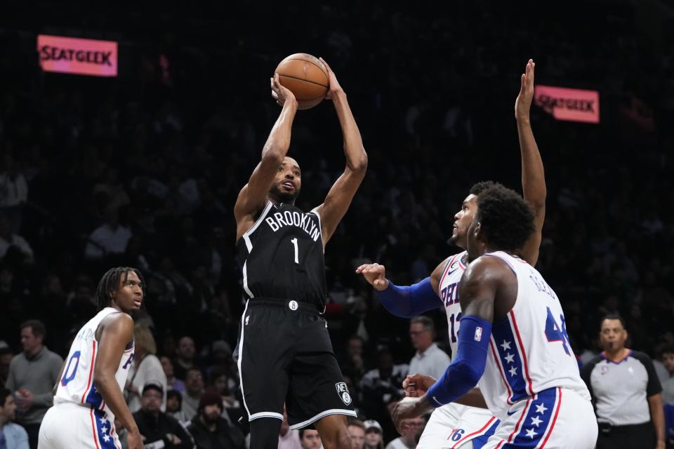 Brooklyn Nets' Mikal Bridges (1) shoots over Philadelphia 76ers' Paul Reed (44) as Tyrese Maxey (0) watches during the second half of Game 4 in an NBA basketball first-round playoff series Saturday, April 22, 2023, in New York. (AP Photo/Frank Franklin II)