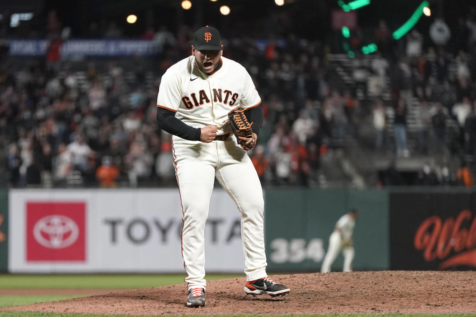 San Francisco Giants pitcher Kervin Castro celebrates after the Giants defeated the San Diego Padres in a baseball game to clinch a postseason berth in San Francisco, Monday, Sept. 13, 2021. (AP Photo/Jeff Chiu)