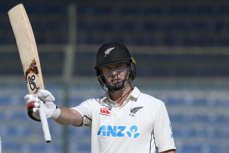 New Zealand's Matt Henry celebrates after scoring 50 runs during the second day of the second test cricket match between Pakistan and New Zealand, in Karachi, Pakistan, Tuesday, Jan. 3, 2023. (AP Photo/Fareed Khan)