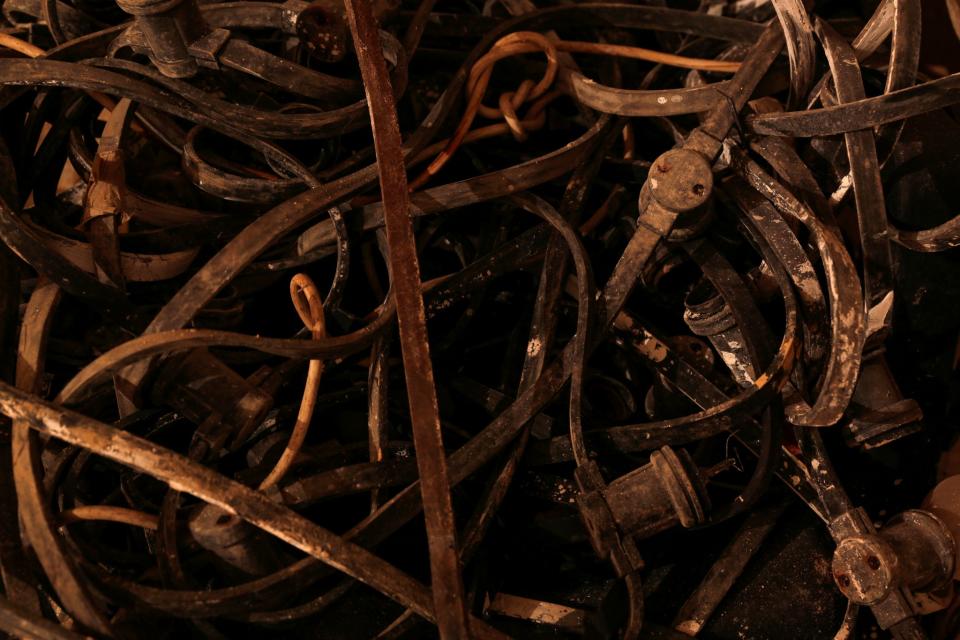 <p>Electricity conduits and cables are plied onto a chair in the Filter Room at the Combined Operations Centre, dating back to World War II, in the War Headquarters tunnels beneath Valletta, Malta, Jan. 24, 2017. (Photo: Darrin Zammit Lupi/Reuters) </p>