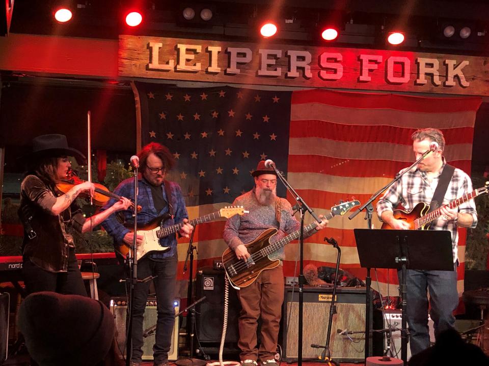 Jason Isbell (right) and wife Amanda Shires (left) took the stage at Fox & Locke on Dec. 23, 2022, for a charity show that raised money for Helping Hands, an organization that helps locals to that community.