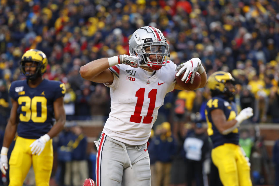Ohio State wide receiver Austin Mack (11) celebrates after scoring on a 16-yard touchdown reception against Michigan in the second half of an NCAA college football game in Ann Arbor, Mich., Saturday, Nov. 30, 2019. (AP Photo/Paul Sancya)