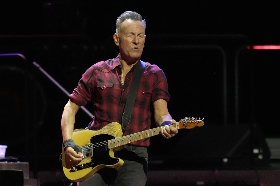 Bruce Springsteen plays his guitar on stage during his concert of Bruce Springsteen and The E Street Band World Tour 2024 performance Tuesday, March 19, 2024, in Phoenix. (AP Photo/Ross D. Franklin)