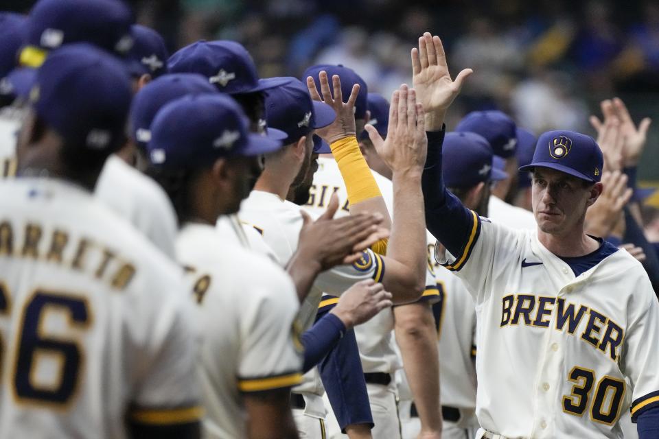 Milwaukee Brewers manager Craig Counsell greets players before Game 1 of their National League wildcard baseball game against the Arizona Diamondbacks Tuesday, Oct. 3, 2023, in Milwaukee. (AP Photo/Morry Gash)