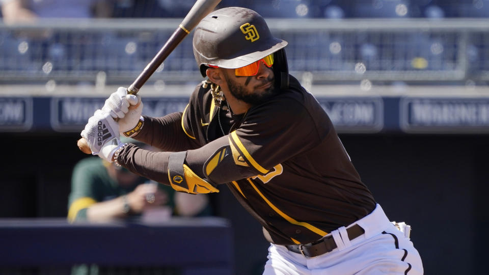 San Diego Padres' Fernando Tatis Jr. bats during a spring training baseball game against the Oakland Athletics, Thursday, March 18, 2021, in Peoria, Ariz. (AP Photo/Sue Ogrocki)