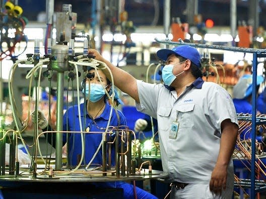 Natawut Lorboon works at the production line of Dunan Metals Thailand Co., Ltd, in the Thai-Chinese Rayong industrial zone in Rayong Province, Thailand, Nov. 8, 2022.