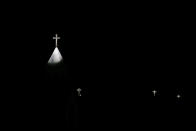 Crosses are lit on the Church of the Nativity, traditionally believed by Christians to be the birthplace of Jesus Christ, during the Christmas tree lightning ceremony in the West Bank city of Bethlehem, Saturday, Dec. 5, 2020. (AP Photo/Majdi Mohammed)