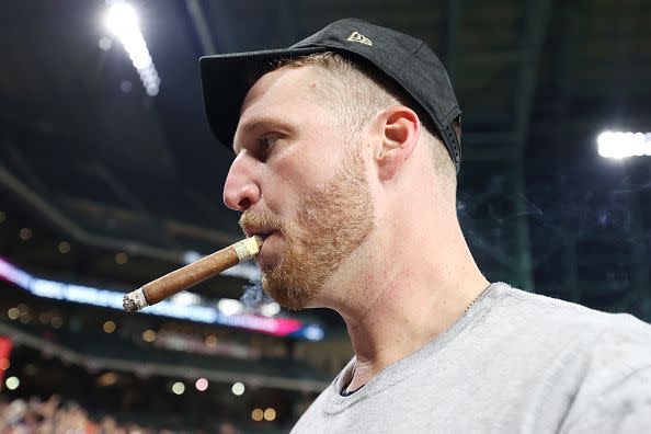 HOUSTON, TEXAS - NOVEMBER 02:  Will Smith #51 of the Atlanta Braves celebrates with a cigar following the team's 7-0 victory against the Houston Astros in Game Six to win the 2021 World Series at Minute Maid Park on November 02, 2021 in Houston, Texas. (Photo by Carmen Mandato/Getty Images)