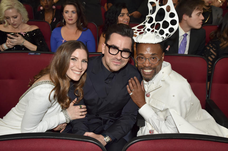 Dan Levy, center, and Billy Porter, right (seen with Sarah Levy at the 2019 American Music Awards) are among the talents being featured in a New York City Pride broadcast this year. (Photo: Jeff Kravitz/AMA2019/FilmMagic for dcp)